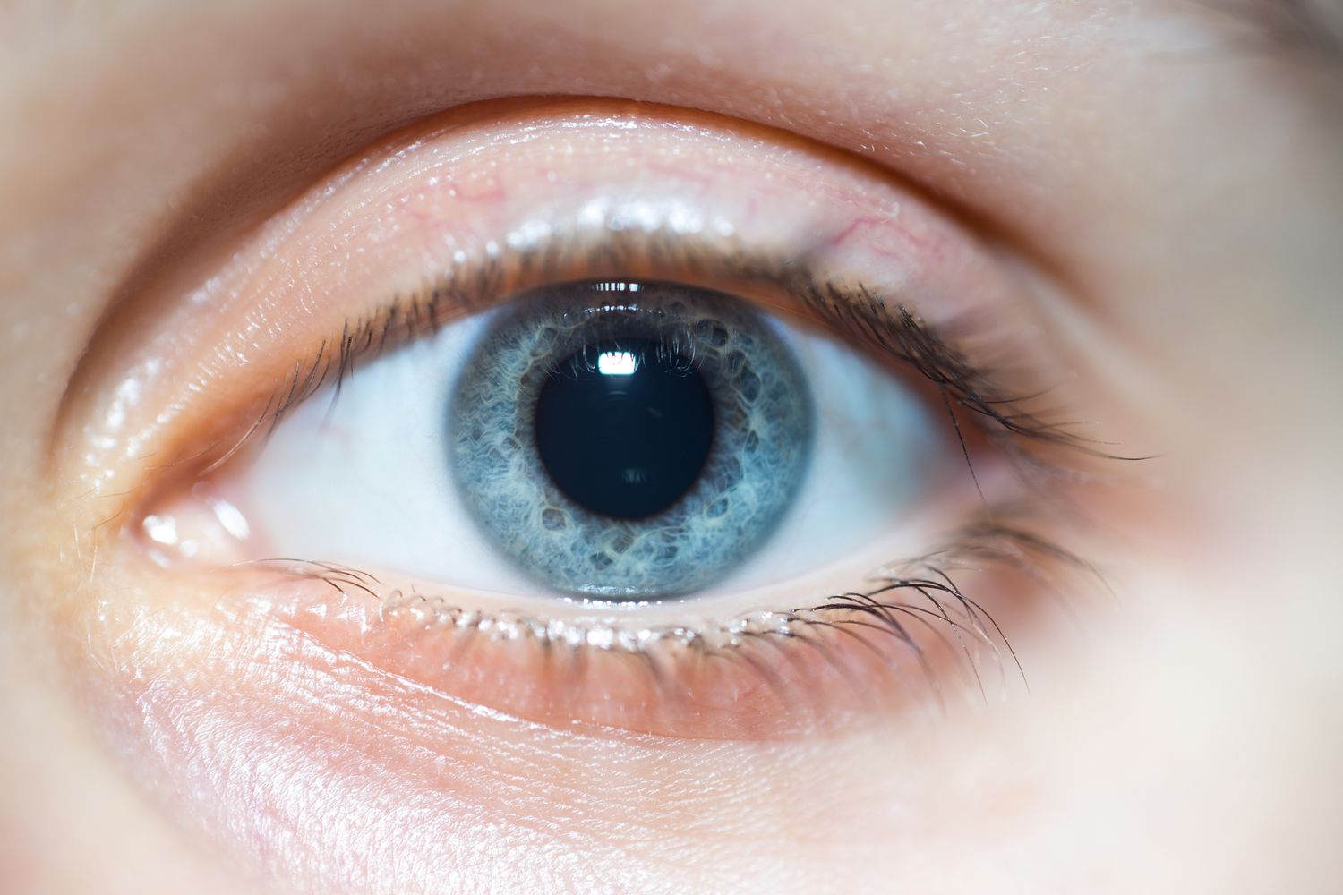 A close up stock photo of a blue eye